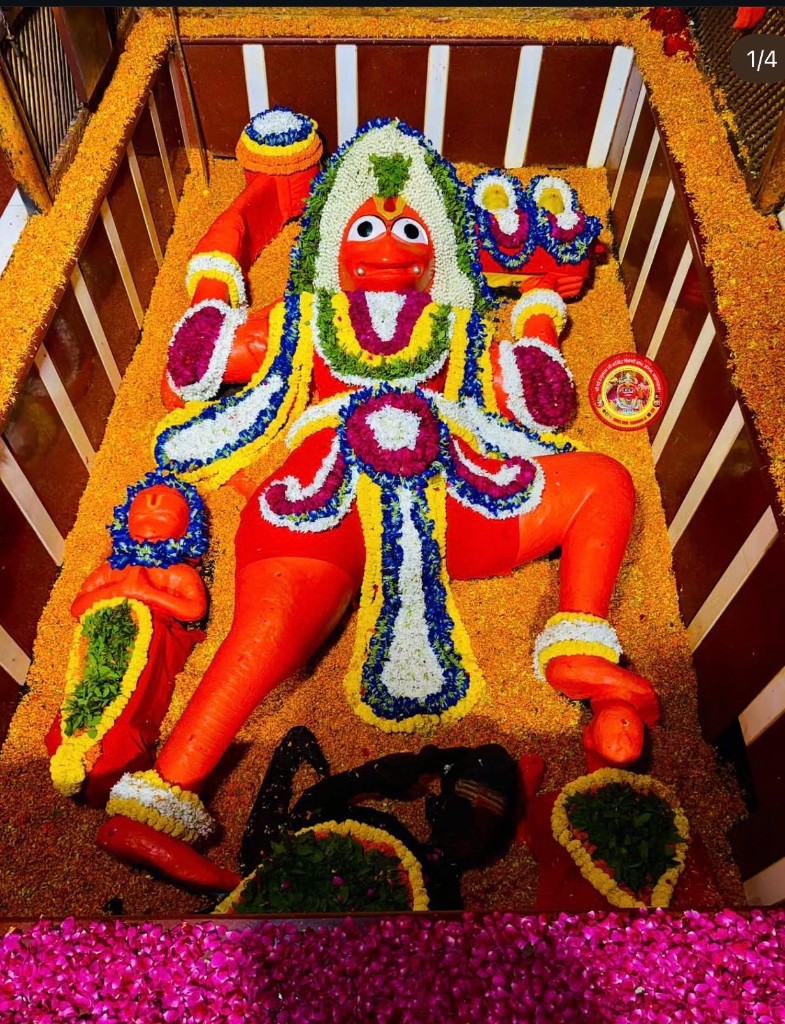 Lete Hue Hanuman Ji with full flower decoration
